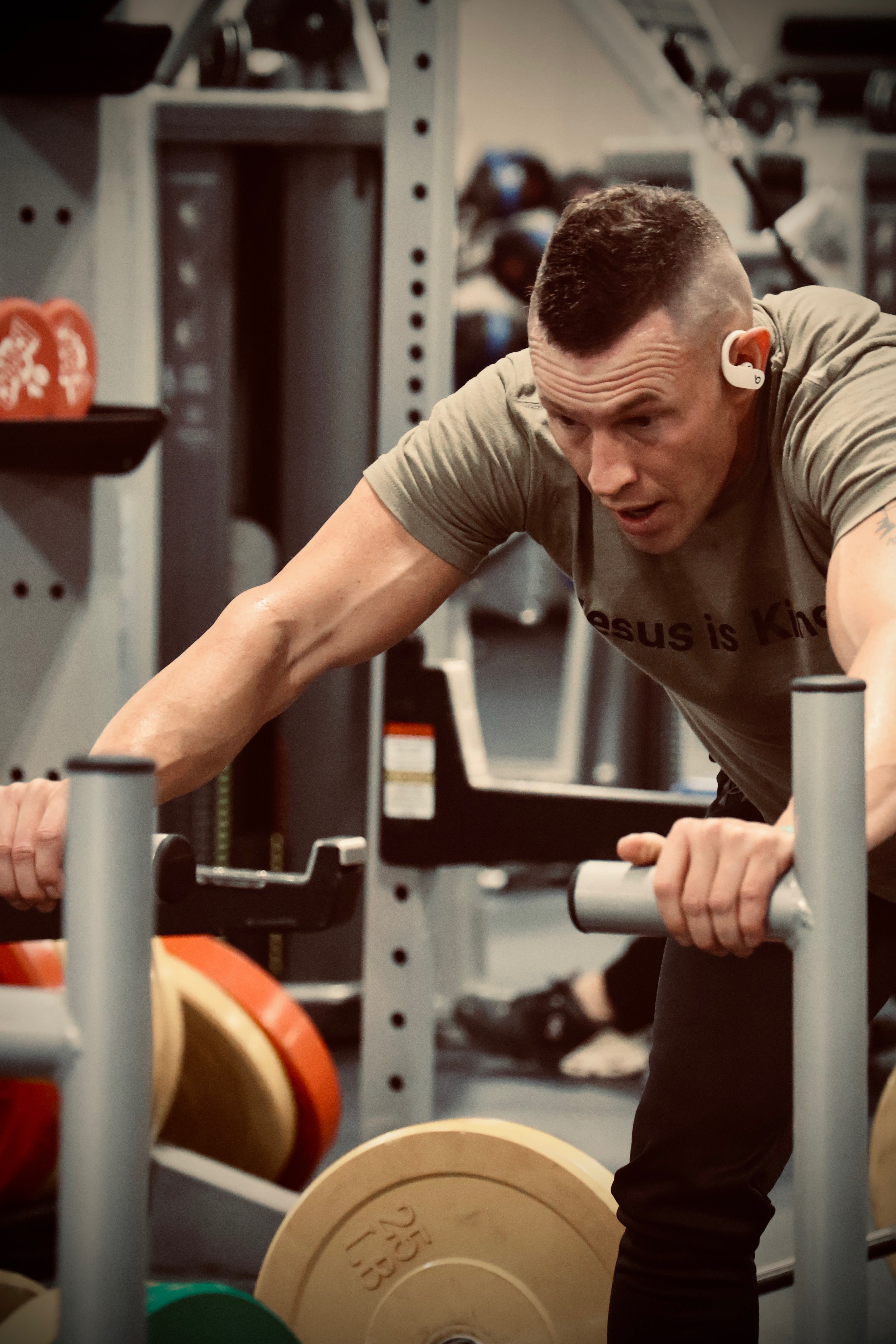 Man lifting weights in a gym setting